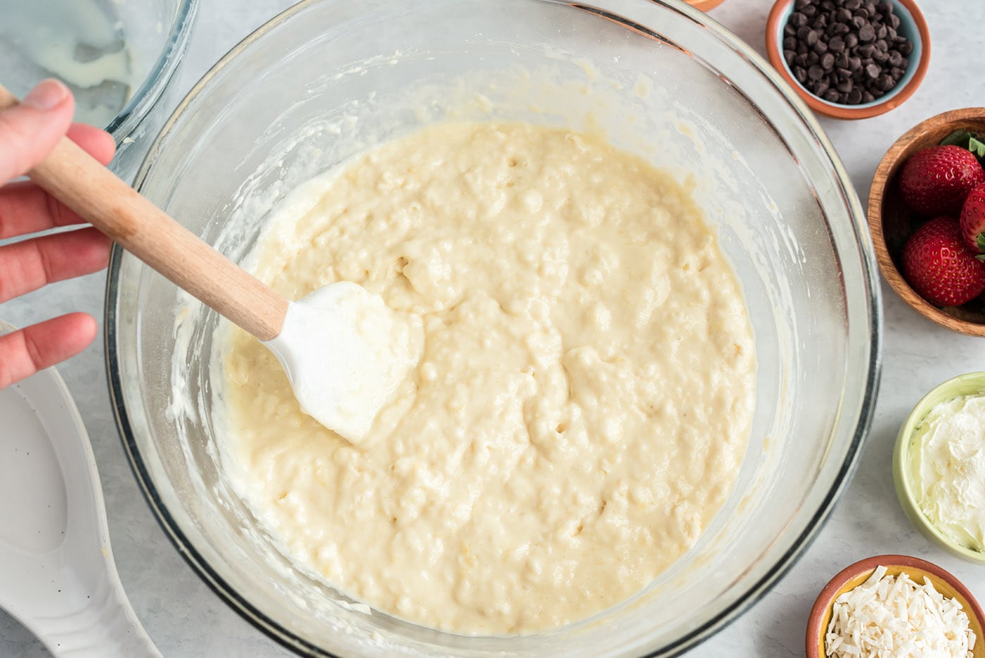 rubber spatula stirring buttermilk pancake batter
