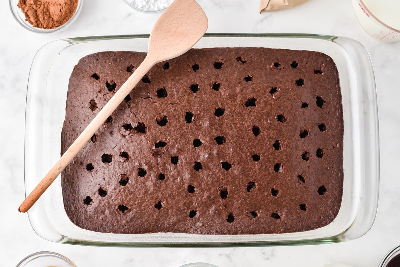 holes poked in a chocolate cake