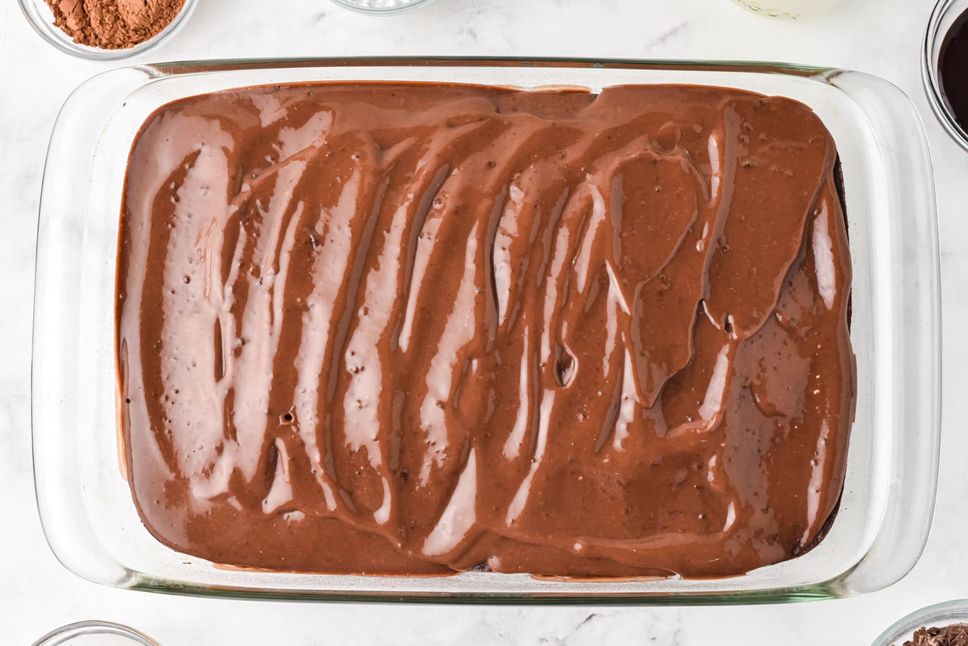 chocolate pudding on top of poke cake