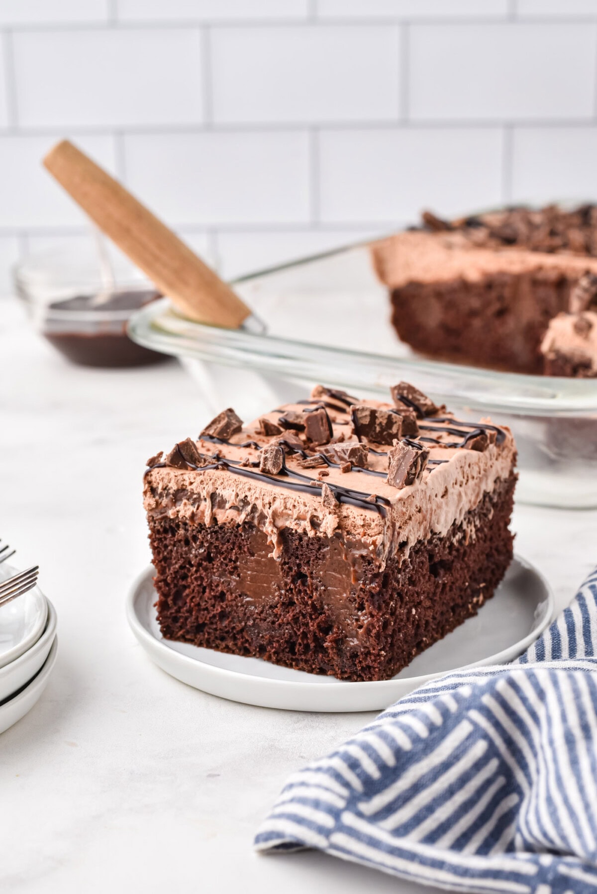 slice of Chocolate Poke Cake on a plate