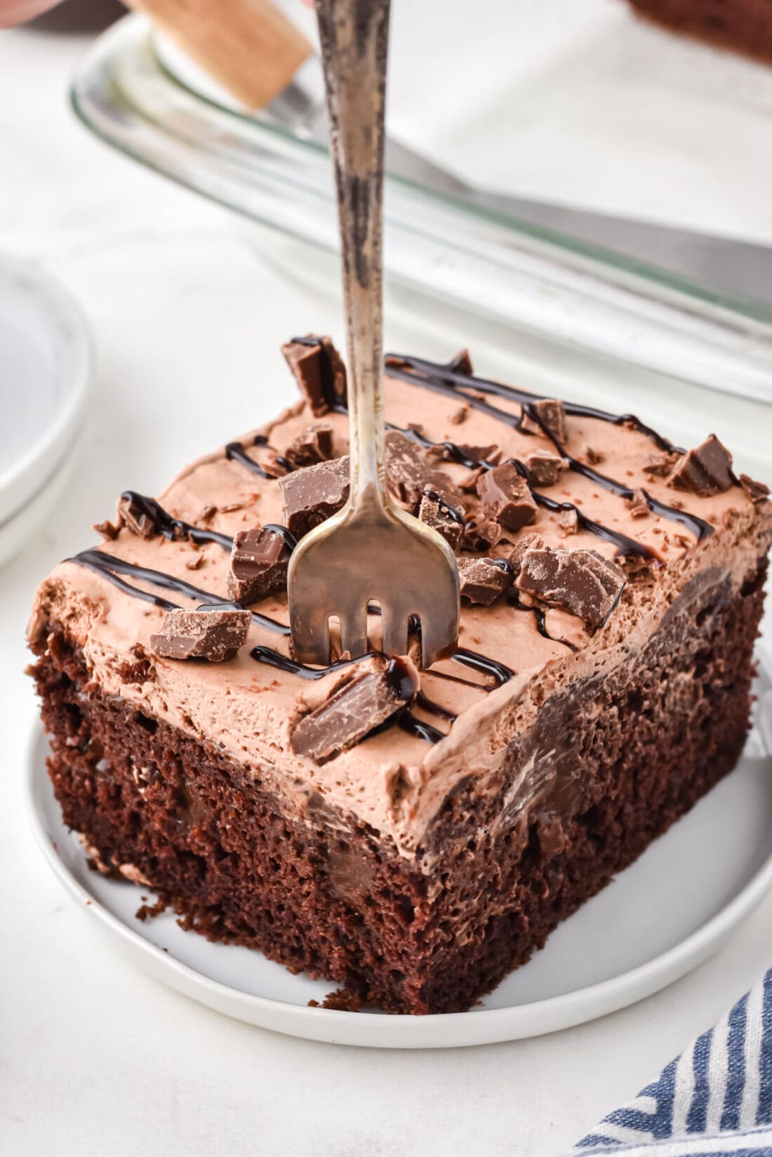 Chocolate Poke Cake with a fork in it