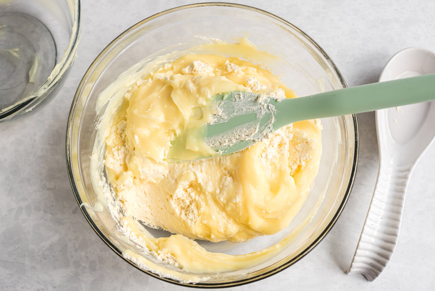 stirring vanilla cream cheese pudding mixture