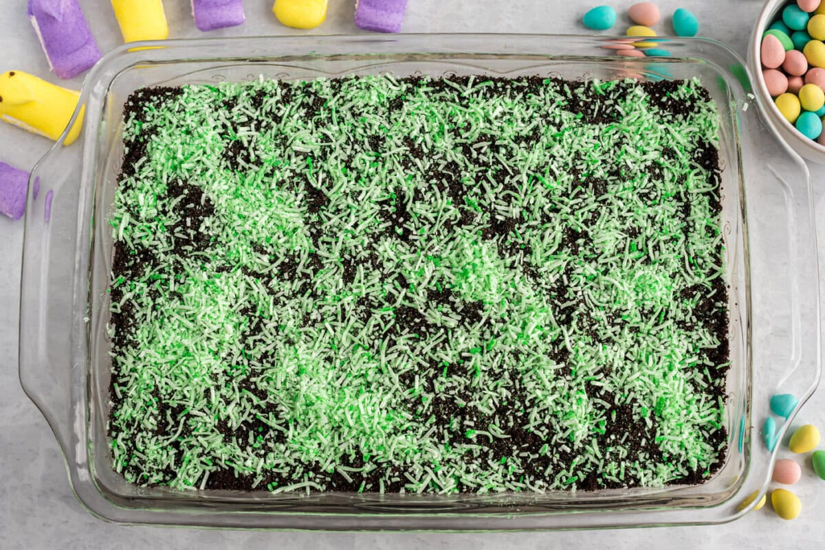 shredded coconut on top of easter dirt cake