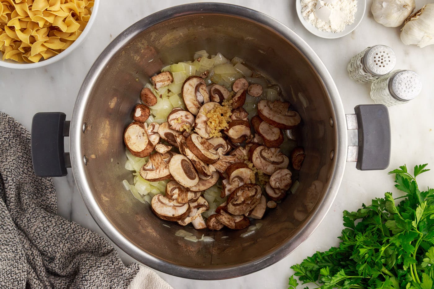 mushrooms, onions, butter, and garlic sauteing in instant pot