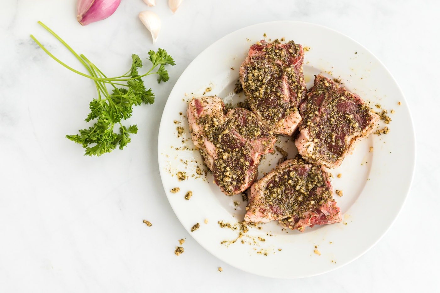 lamb chops with rub on a plate