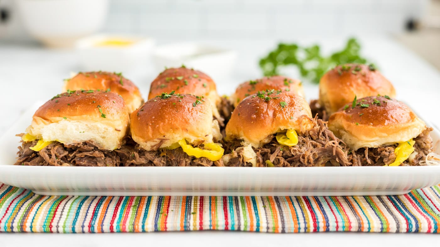 Robust pot roast meets tangy pepperoncini and provolone cheese in these mouth-watering sliders. Perf