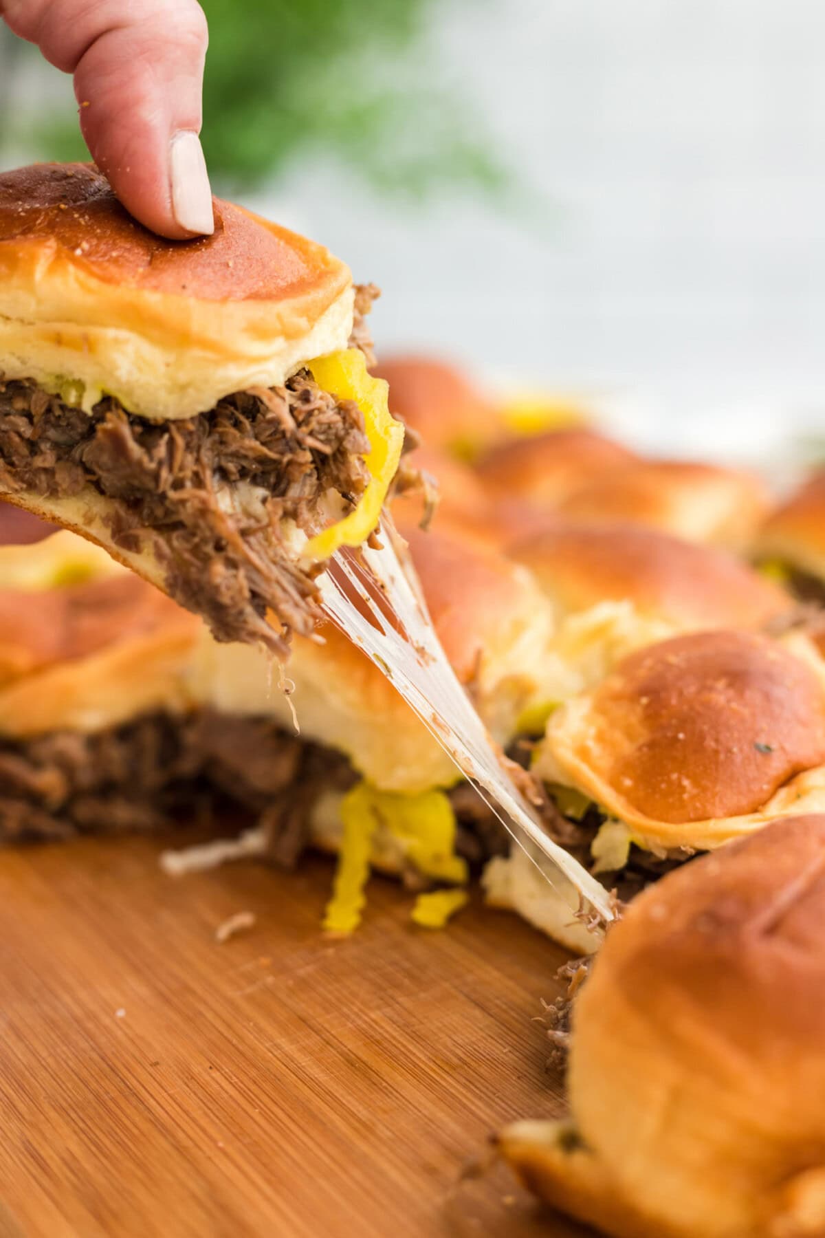lifting a Mississippi Pot Roast Slider from pan