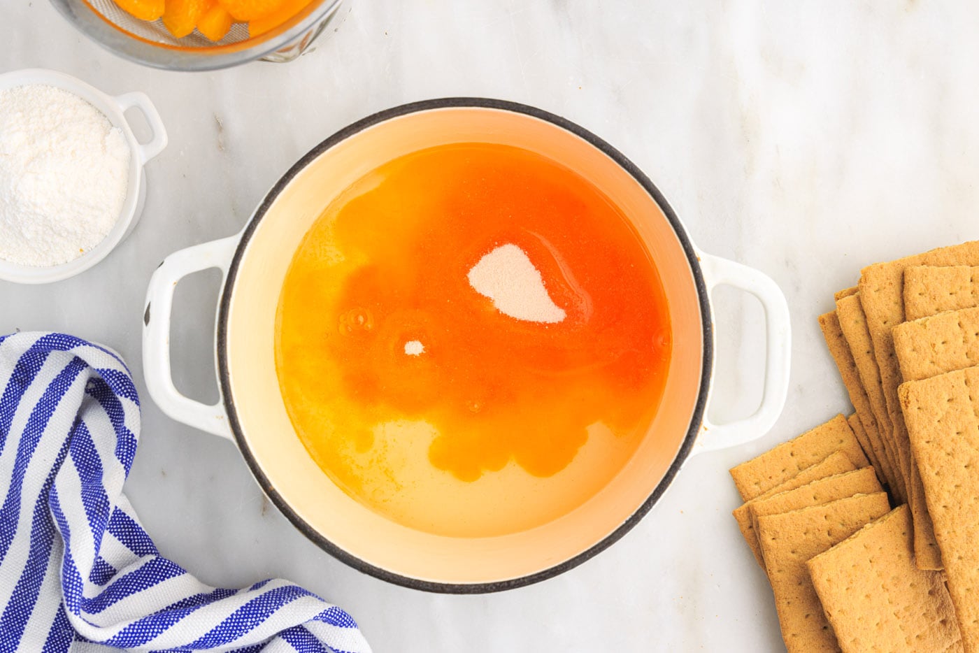mandarin orange juice with vanilla pudding in saucepan