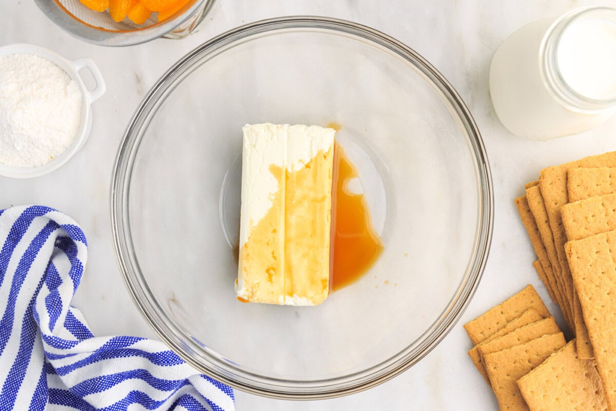 cream cheese and vanilla extract in mixing bowl