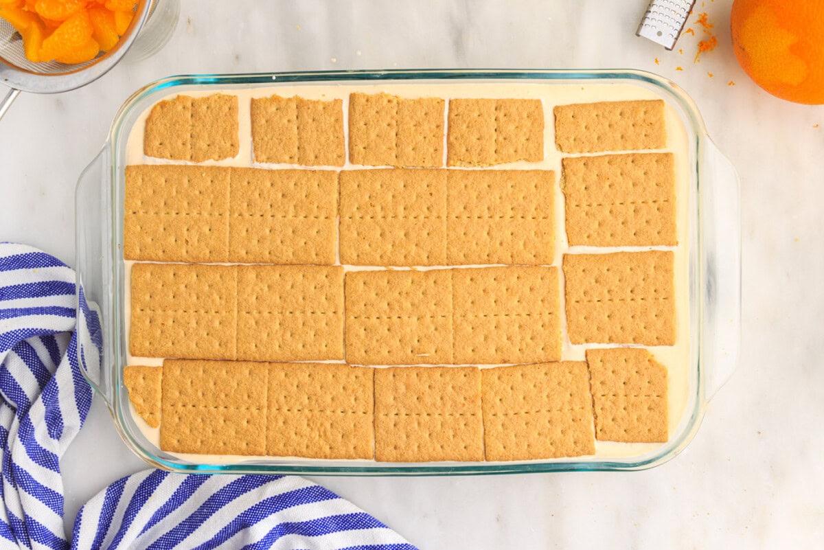 graham crackers on top of orange icebox cake