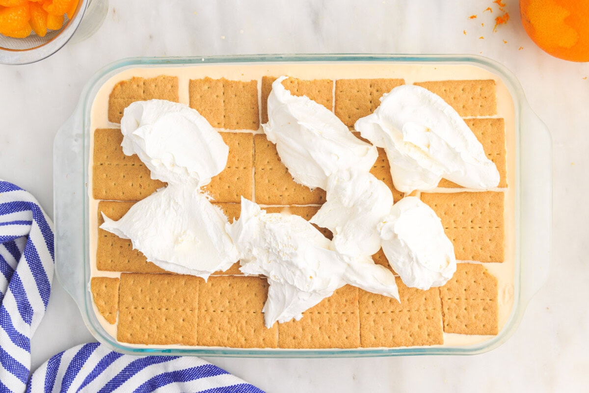 whipped cream on top of orange icebox cake