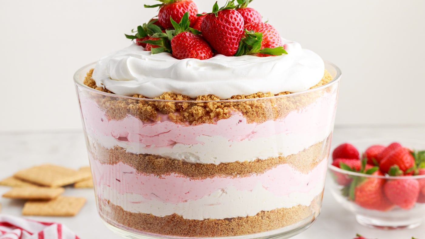 Strawberry lasagna trifle has multiple layers of graham cracker crumbs, cheesecake, and whipped stra