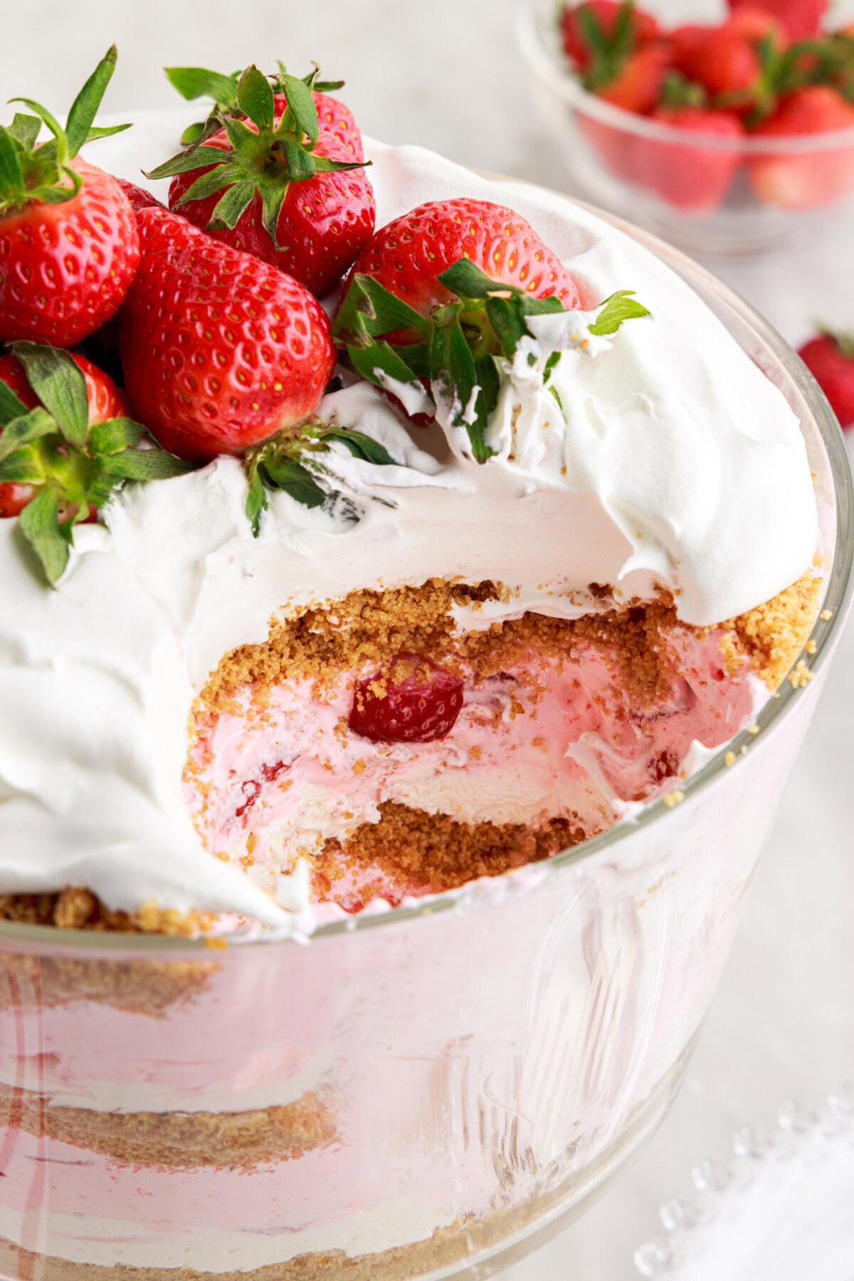 Strawberry Lasagna Trifle with spoon full removed
