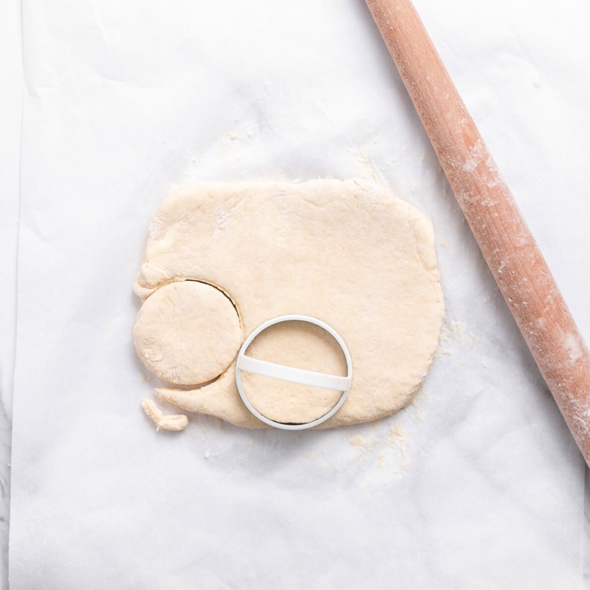 biscuit cutters cutting dough