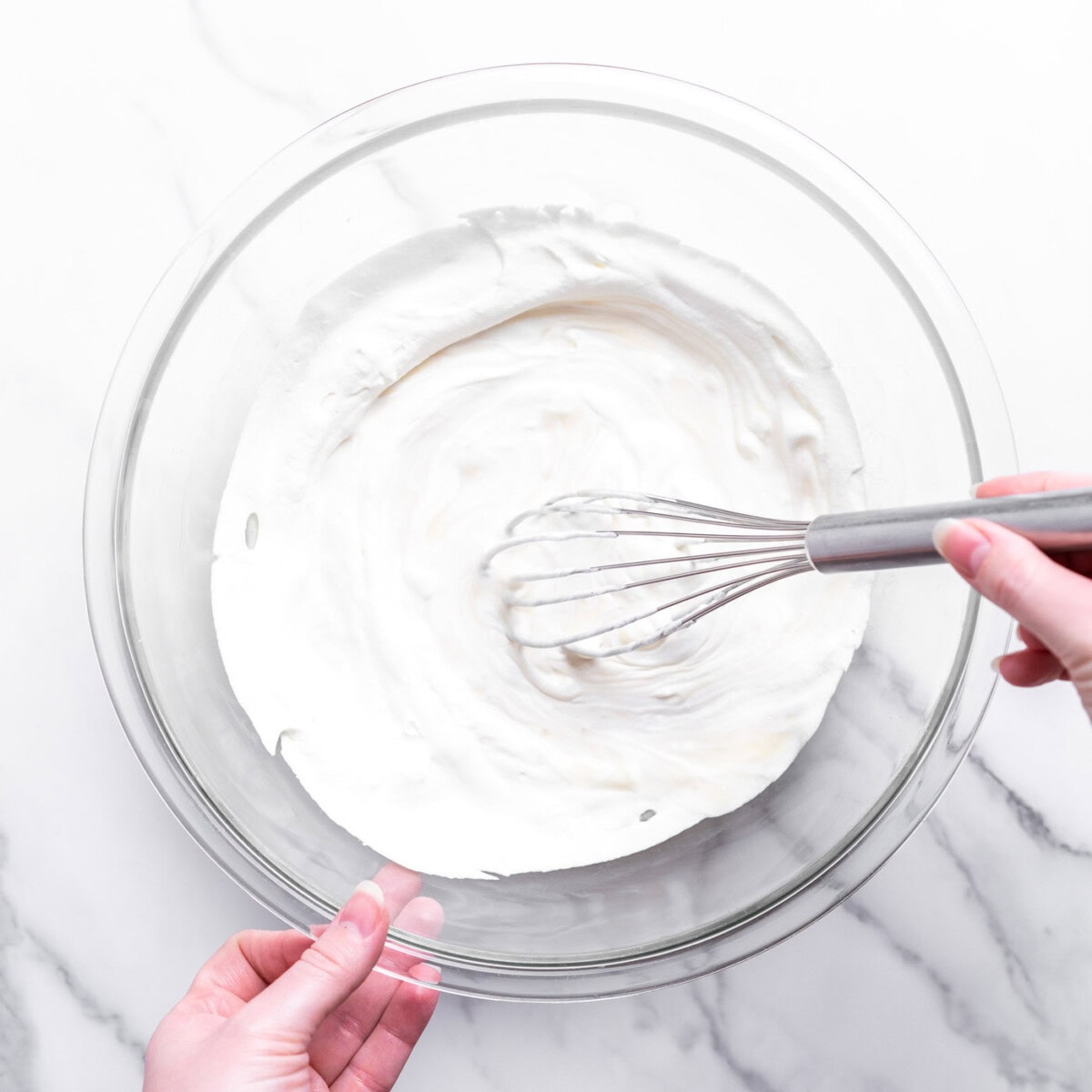 whisking together sweetened condensed milk and whipped cream