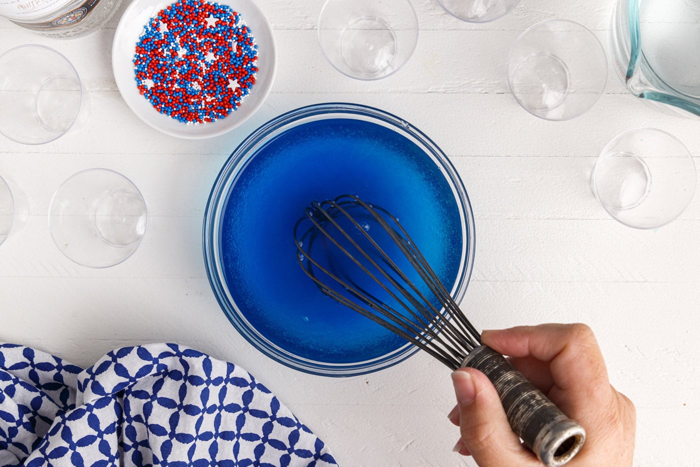 whisking blue jello with water