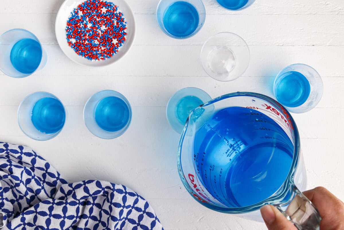 pouring jello into a shot glass