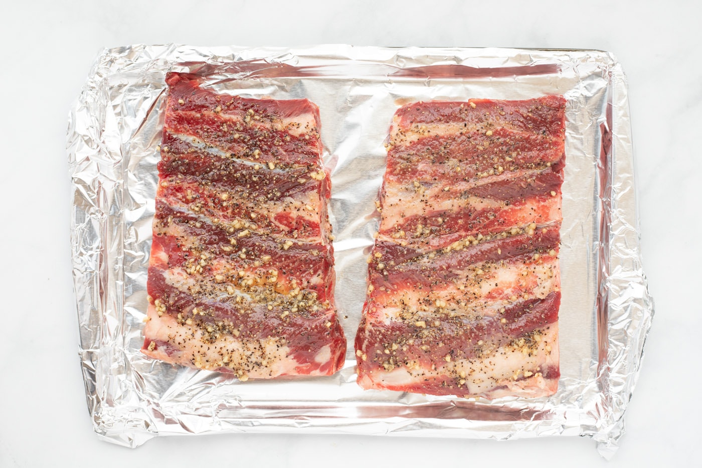 beef chuck riblets on a baking sheet