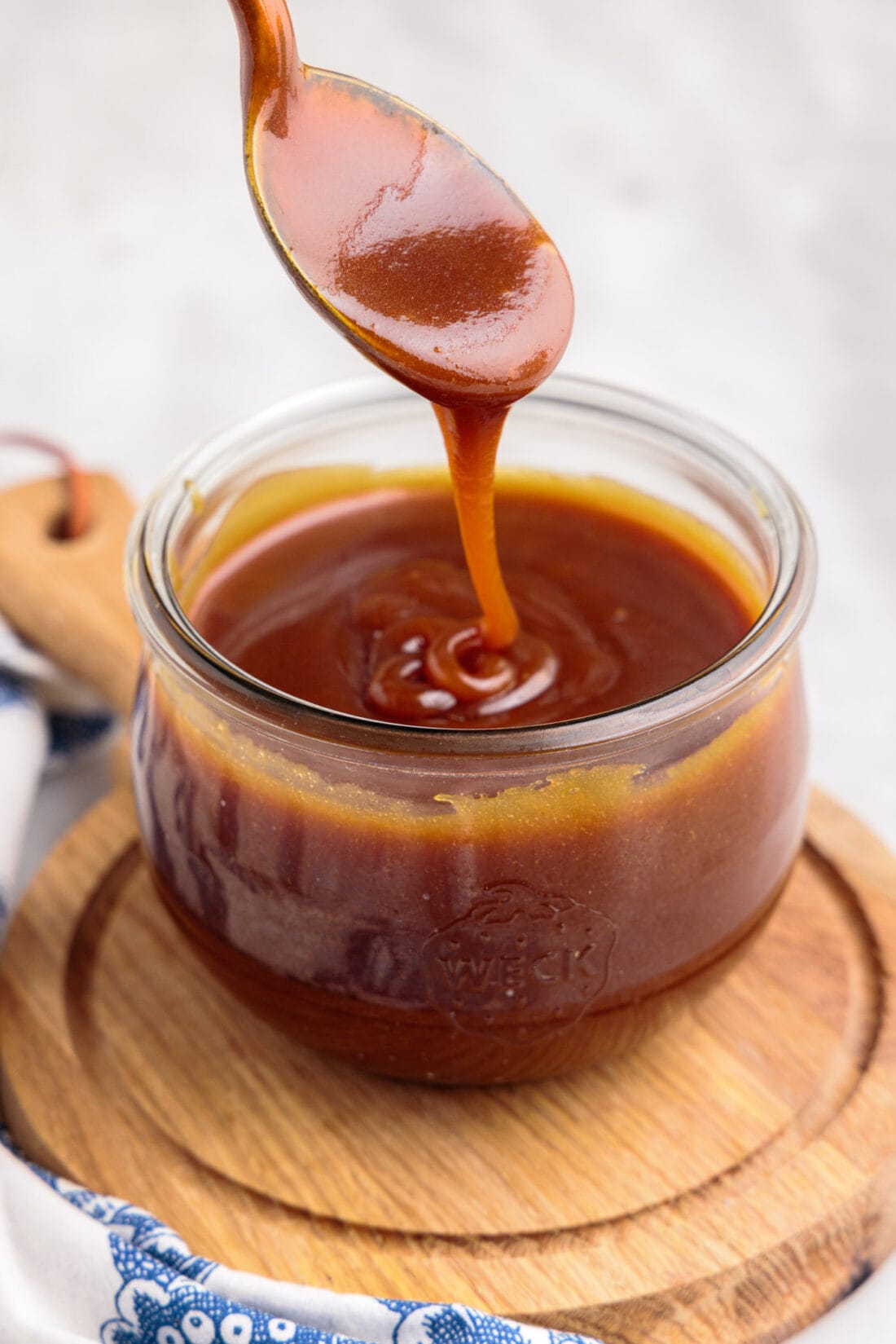 spoon in jar of Caramel Sauce