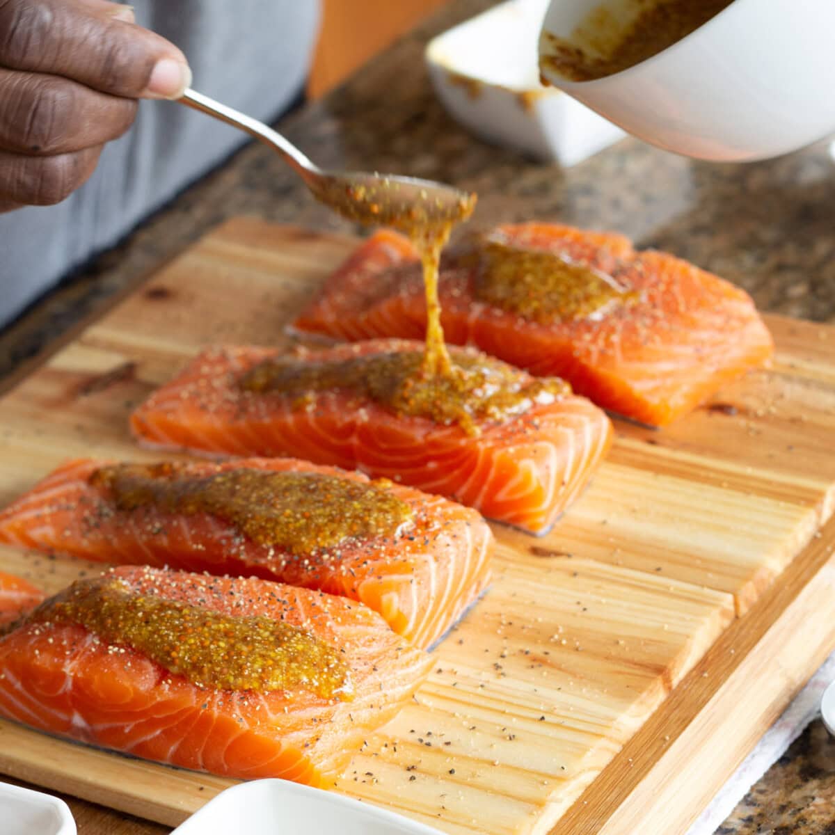 seasoning salmon with mustard, honey, and brown sugar