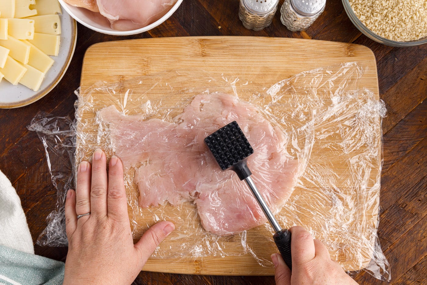 pouding chicken breast with meat tenderizer