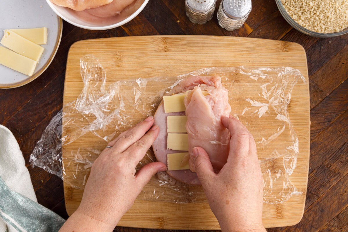 rolling chicken breast with ham and cheese