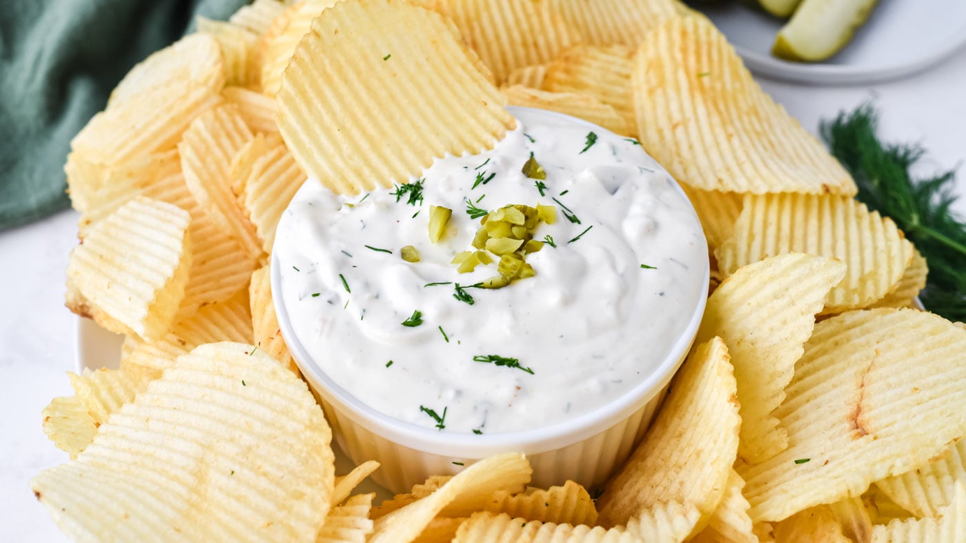 Dill pickle dip is made with a mayo-sour cream base that's loaded with seasonings, fresh dill weed, 