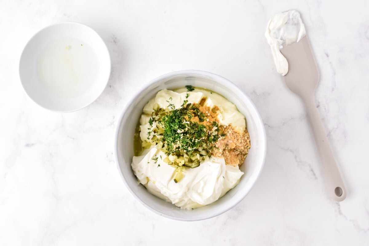 dill pickle dip ingredients in a bowl