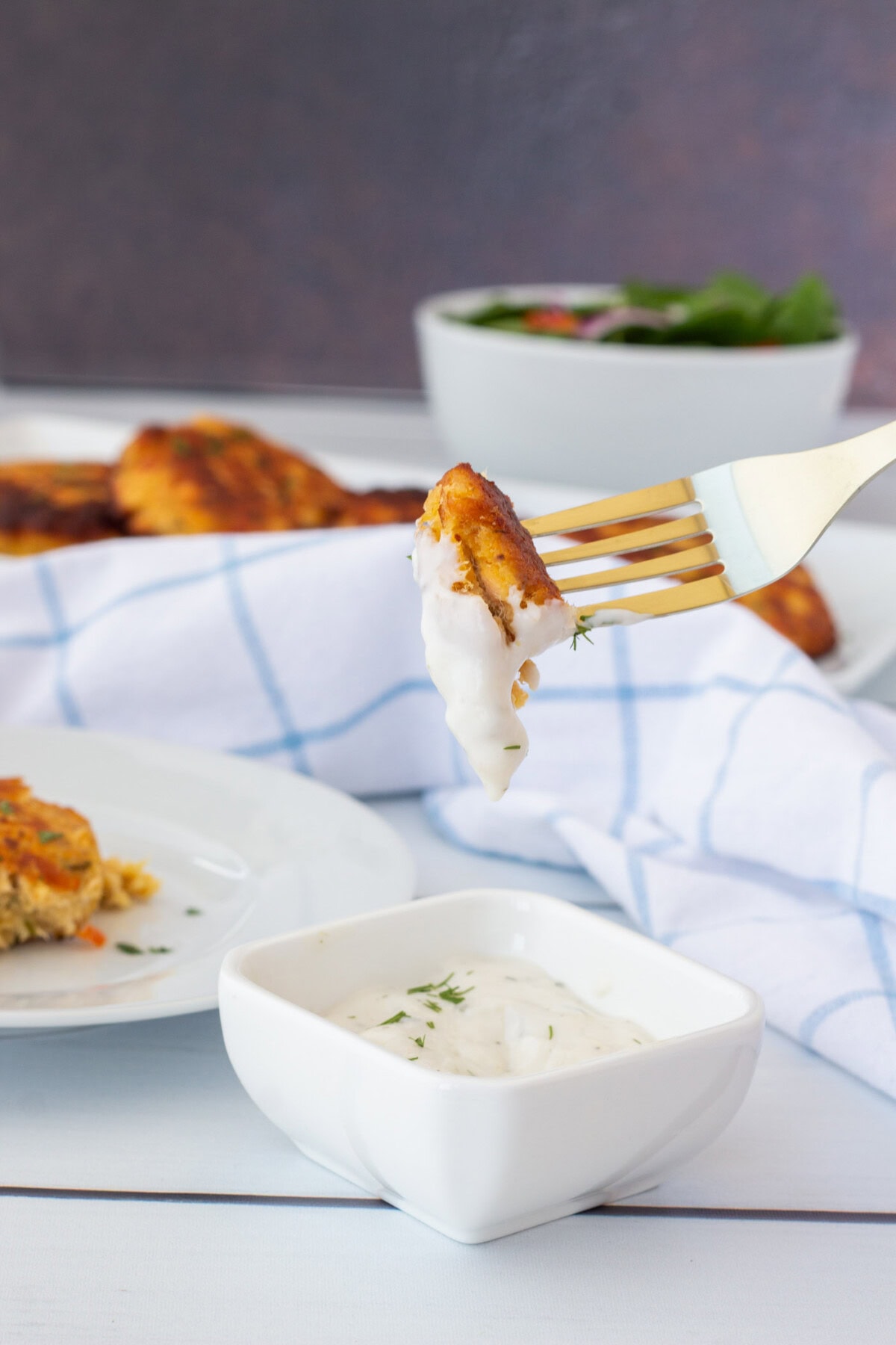 fork of Fish Cake dipped in sauce