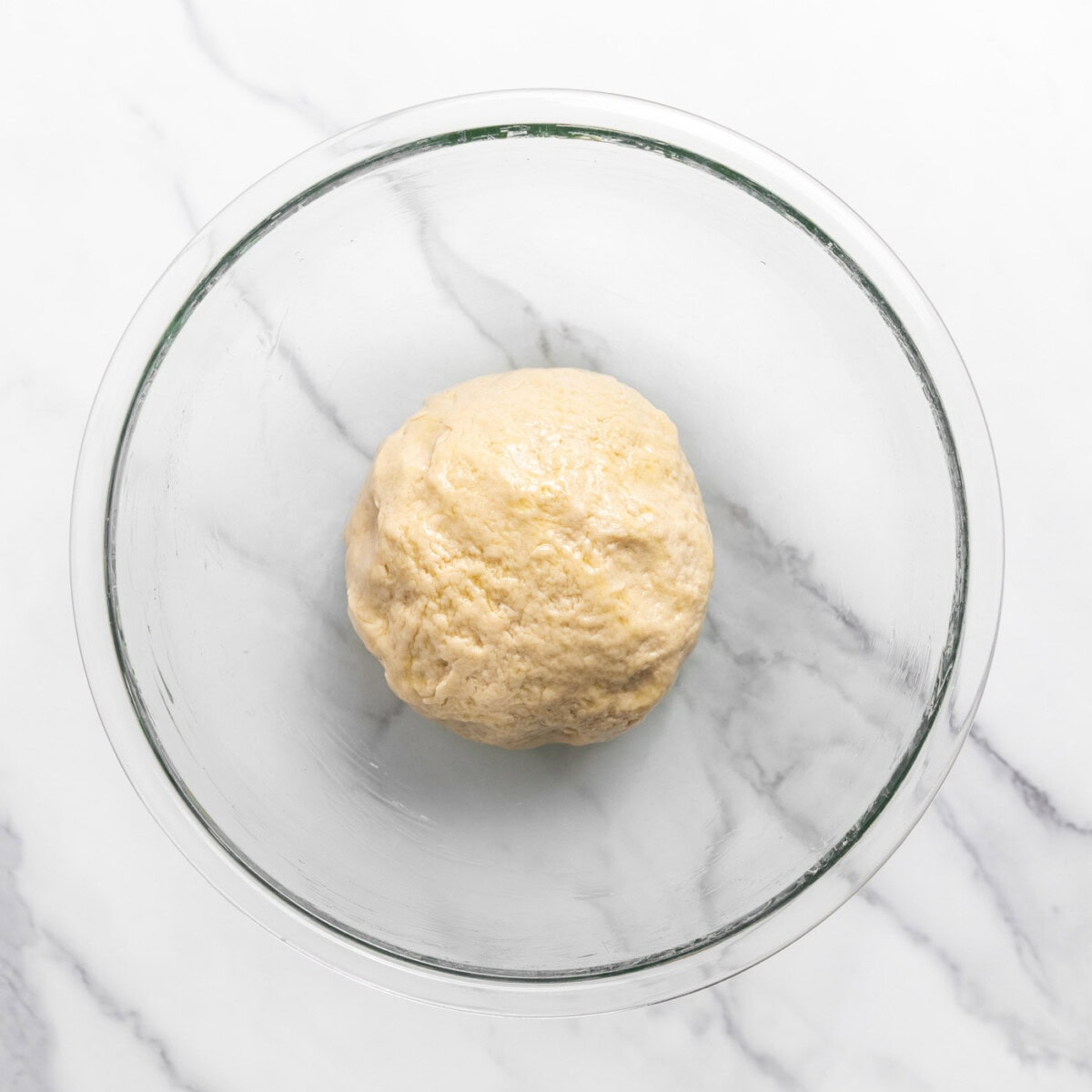 dough ball in a mixing bowl