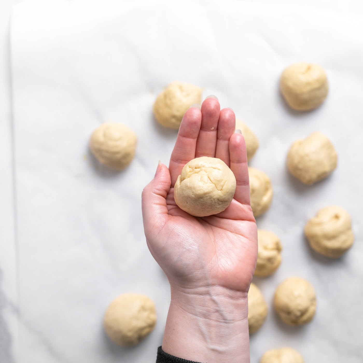 dough balls in hand