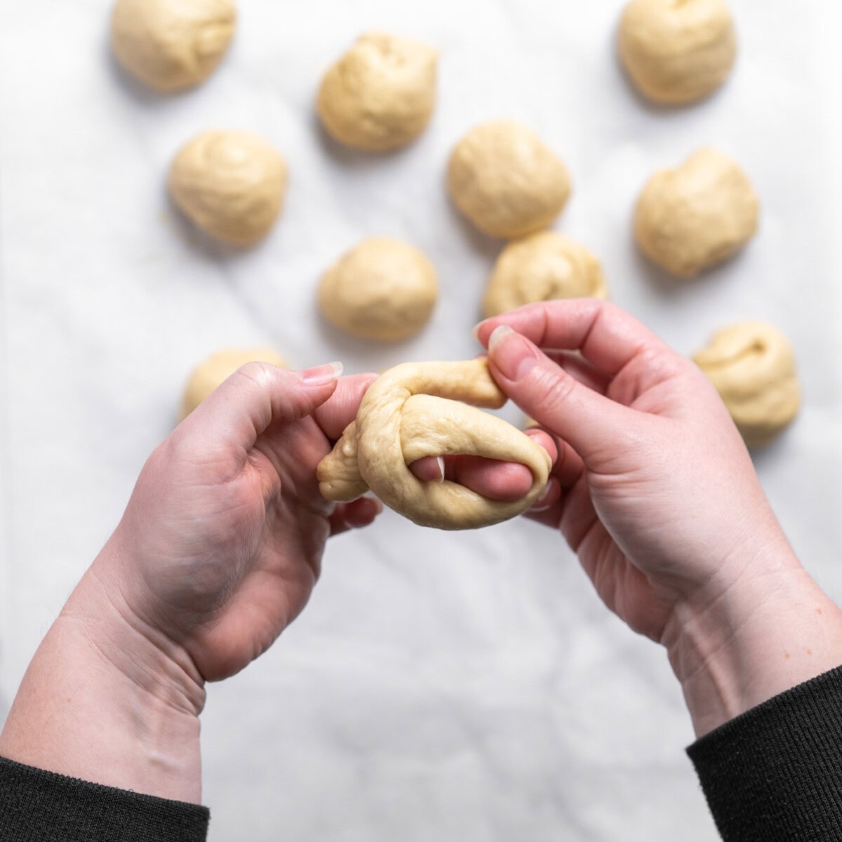 tieing dough into a knot