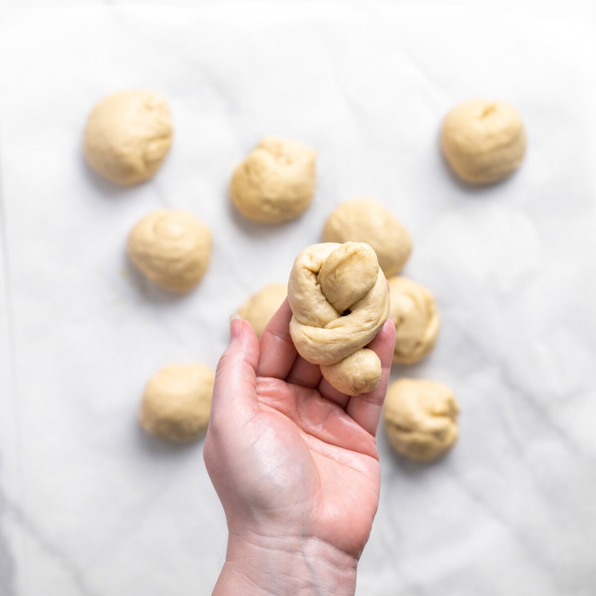 garlic knot dough in hand