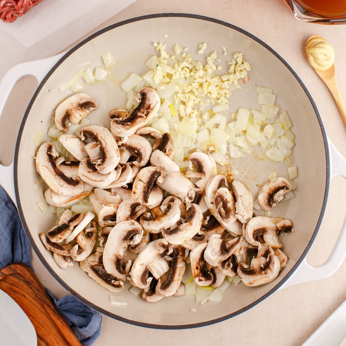 sauteeing mushrooms in onions and butter