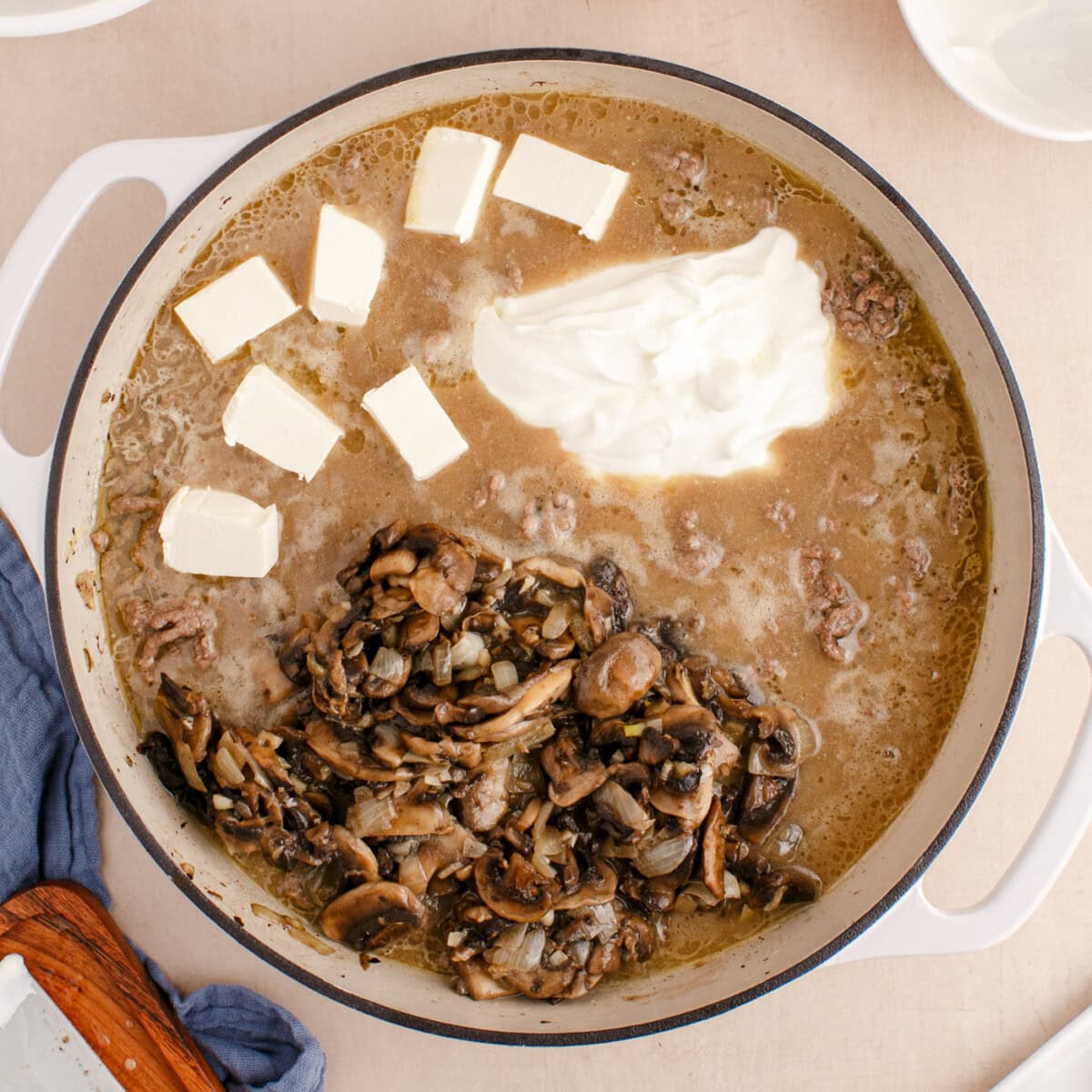 mushrooms, sour cream, and cream cheese added to ground beef strofanoff