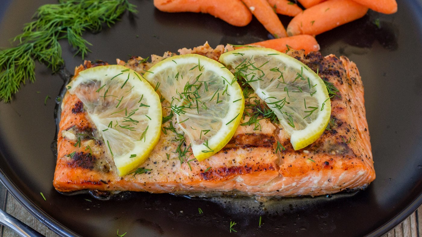 Our classic lemon salmon recipe is first sprinkled with garlic salt and lemon pepper, then marinated