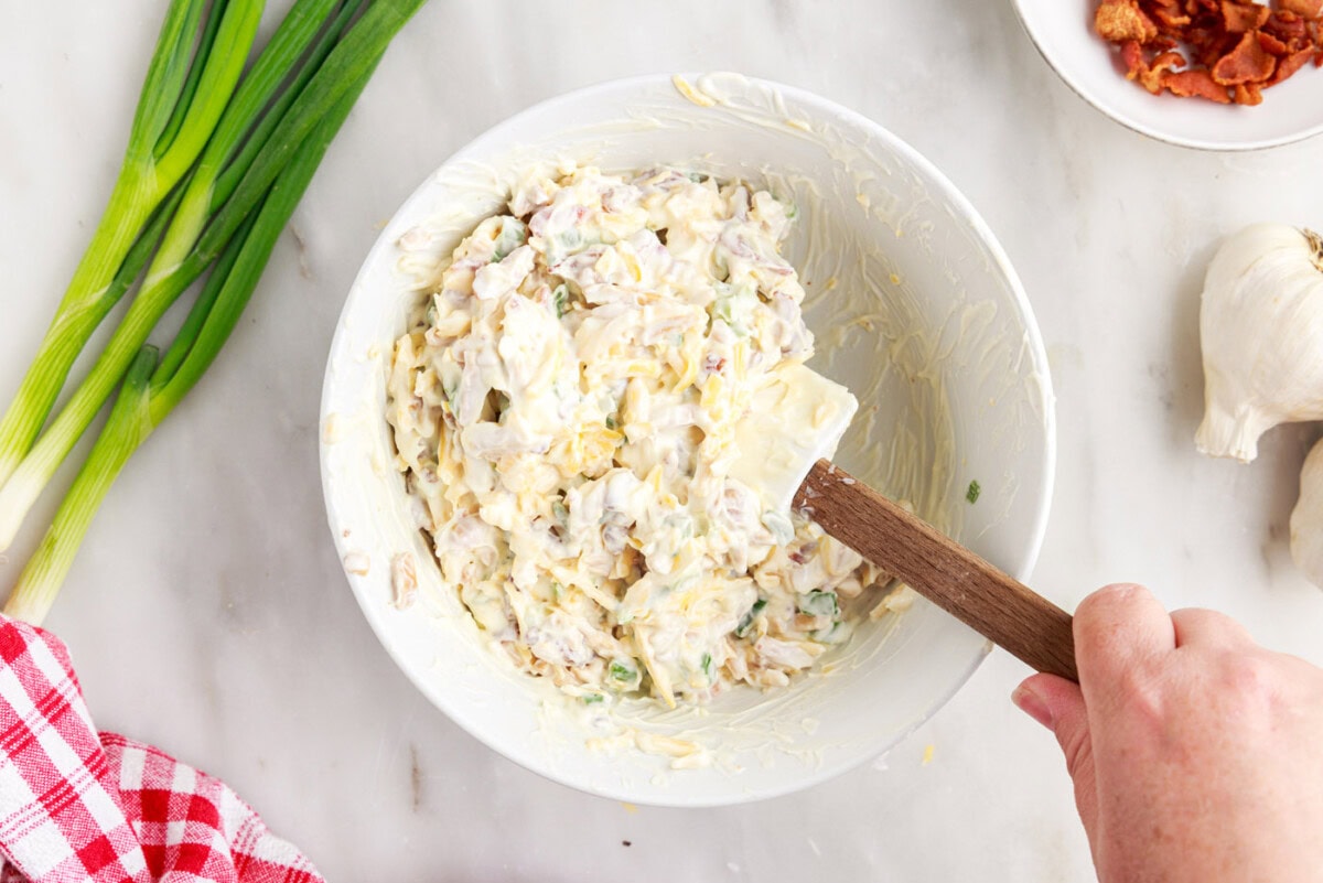 mixing million dollar dip in a bowl