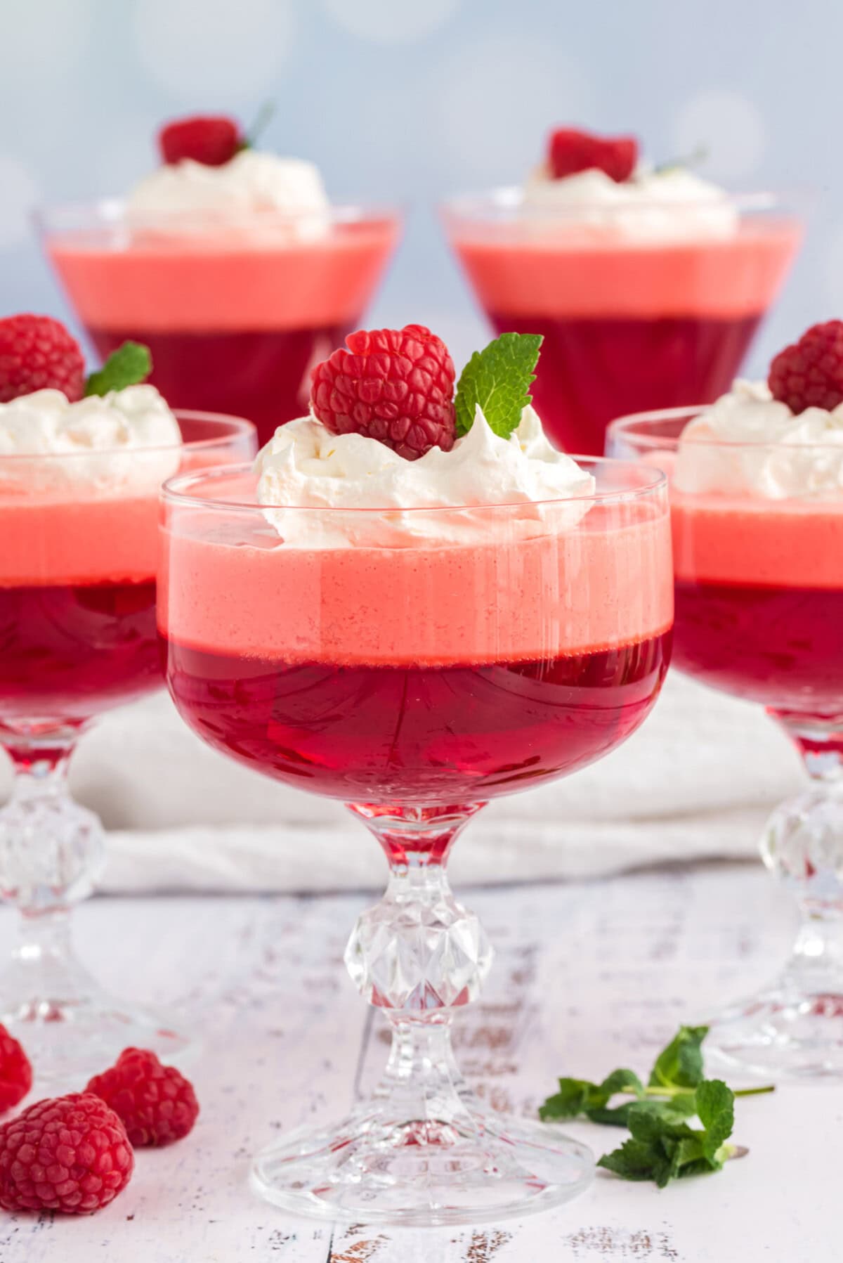 Raspberry Jell-O Parfaits with whipped cream
