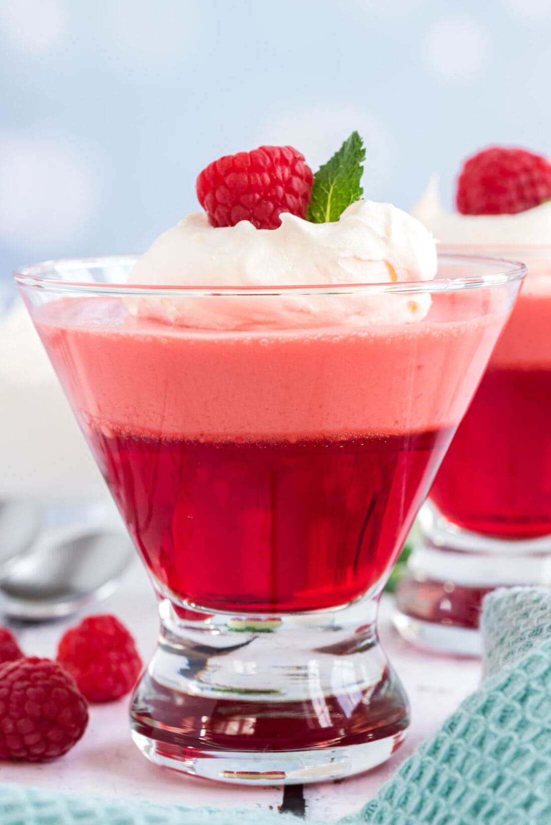 one Raspberry Jell-O Parfait in a glass dessert dish