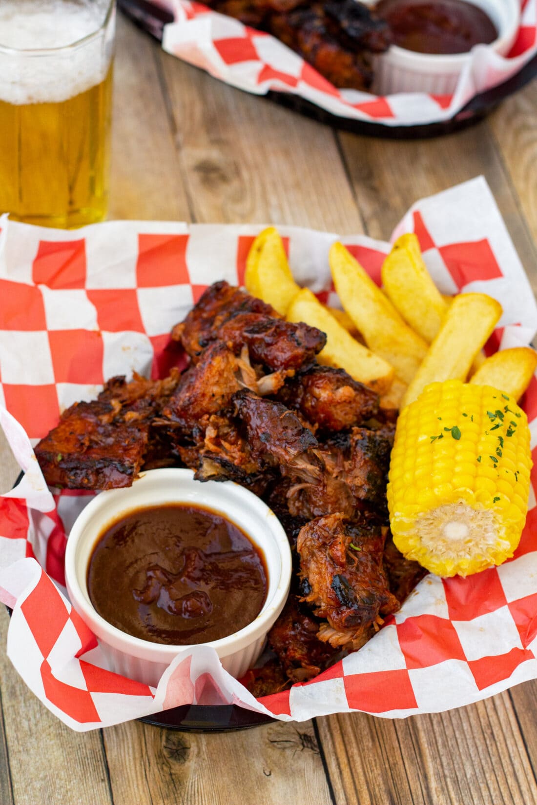 Rib Tips in a basket with sauce and corn
