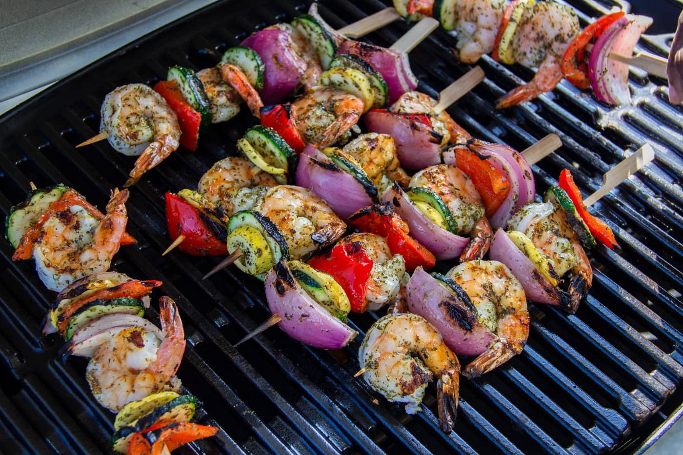 cooked shrimp kabobs on the grill