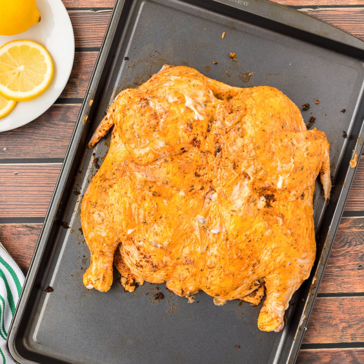 spatchcock chicken on a baking tray