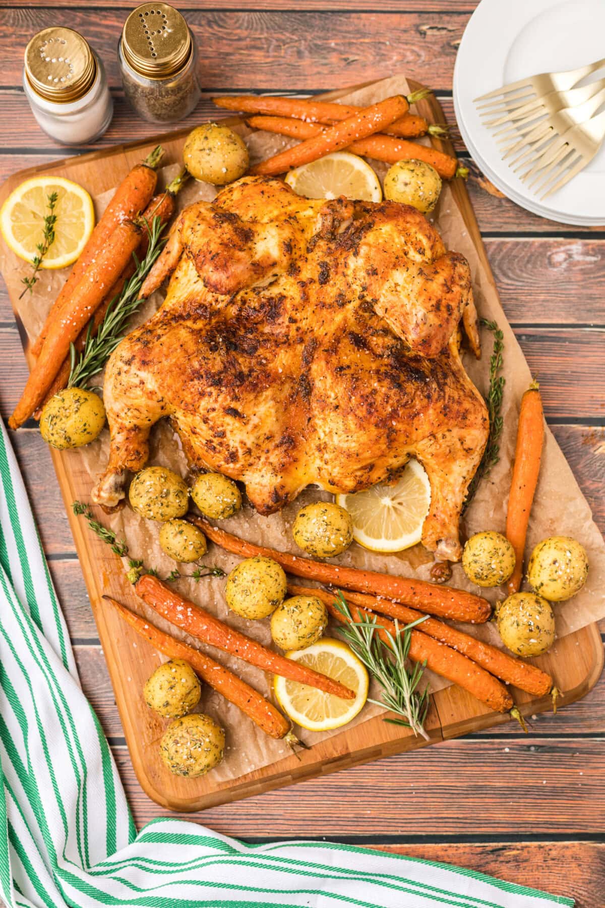 Spatchcock Chicken with roast vegetables on board