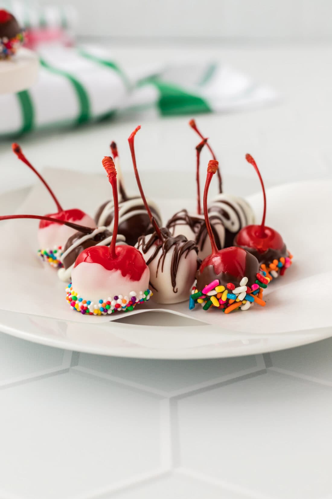 chocolate dipped Spiked Cherries on a plate