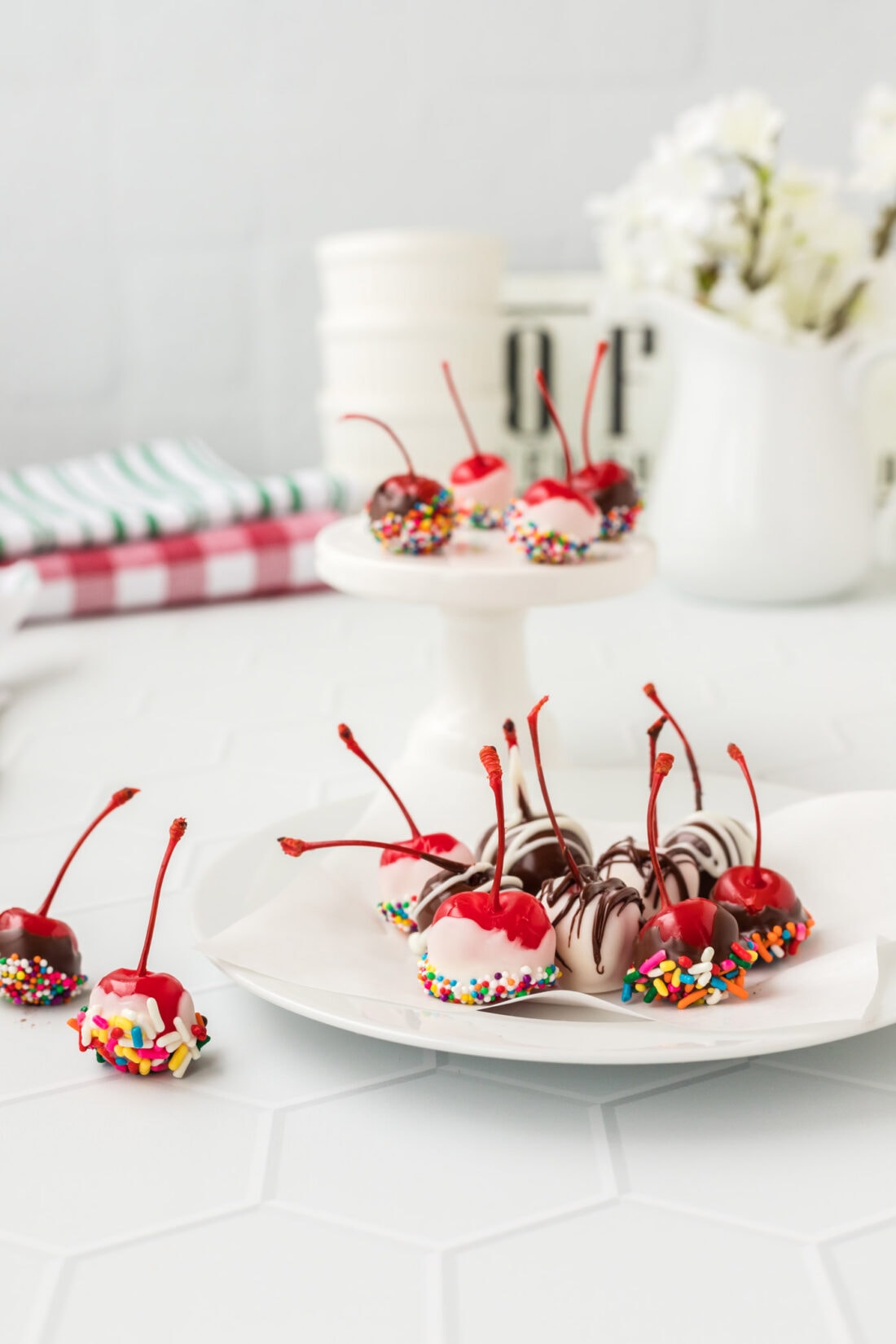 Spiked Cherries on a plate with flowes in background