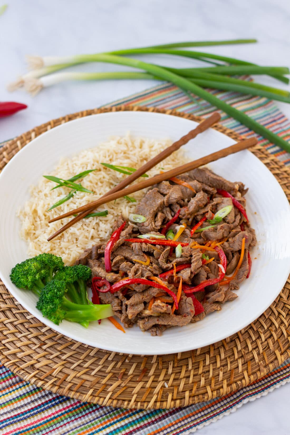 plate of Szechuan Beef with chopsticks