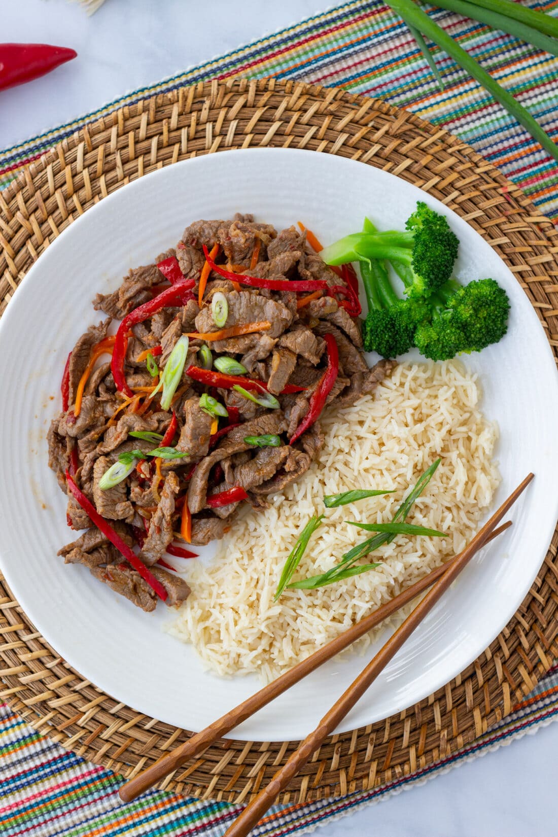 overhead view of Szechuan Beef on plate with rice