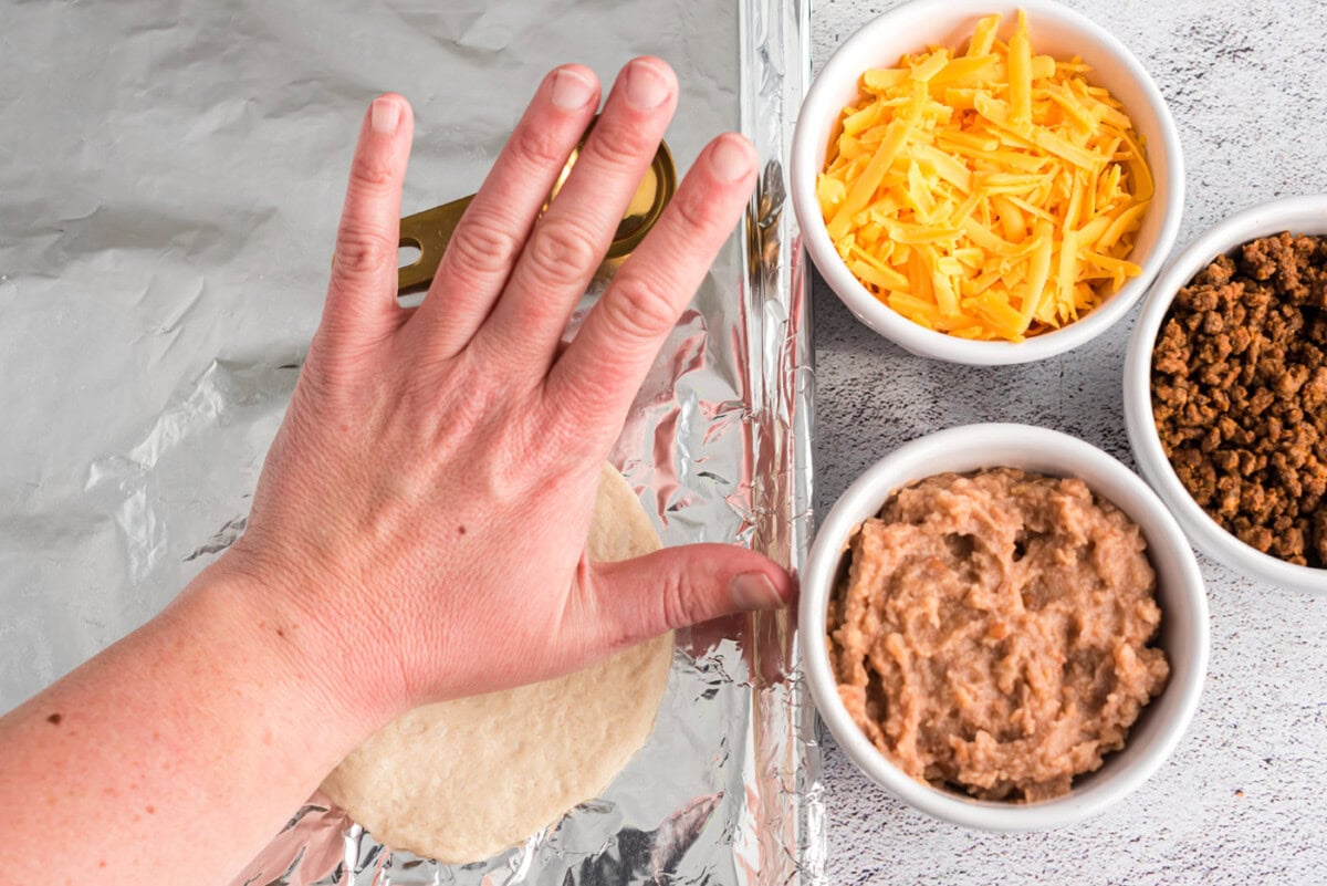 flattening refrigerator dough on foil