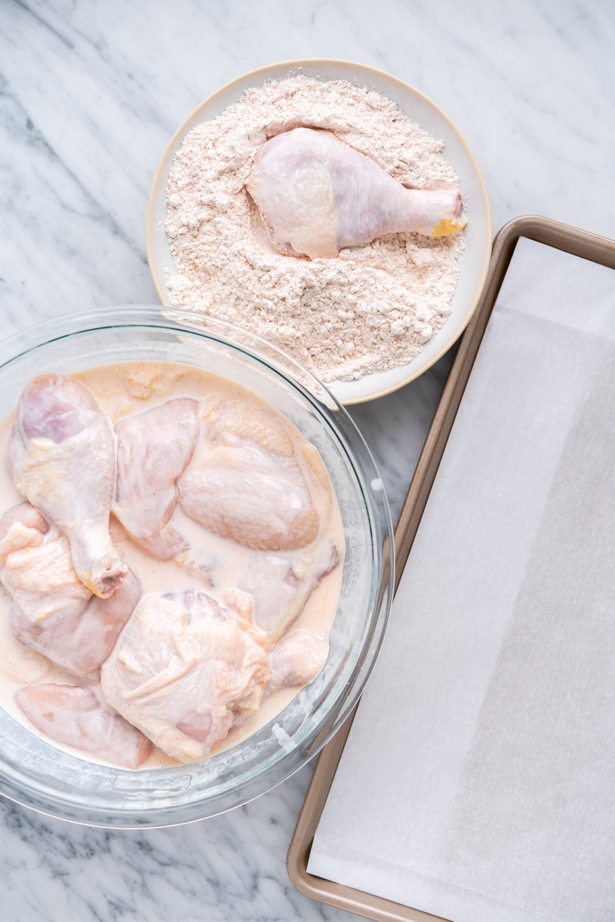 dredging chicken in seasoned flour