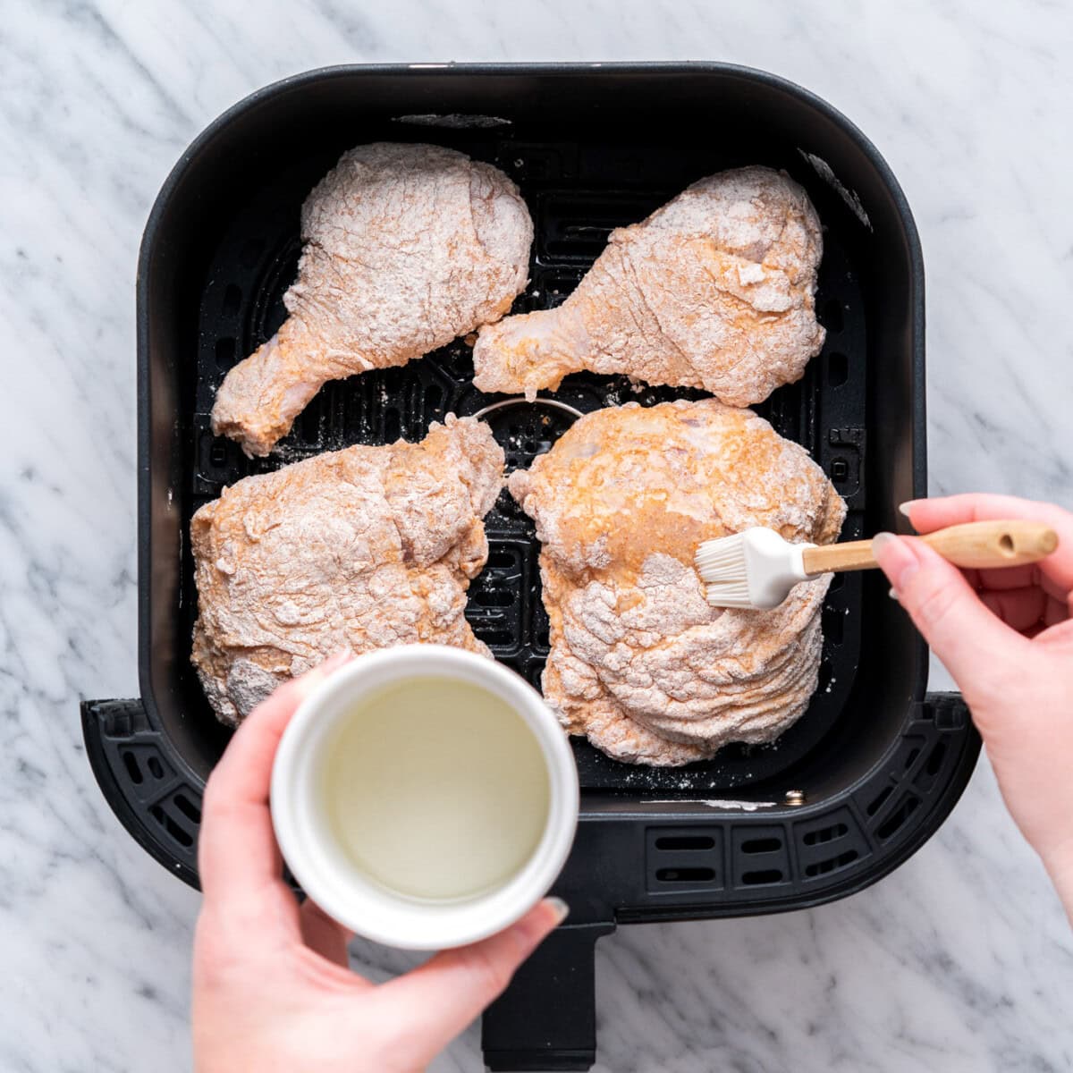 brushing dredged chicken with oil